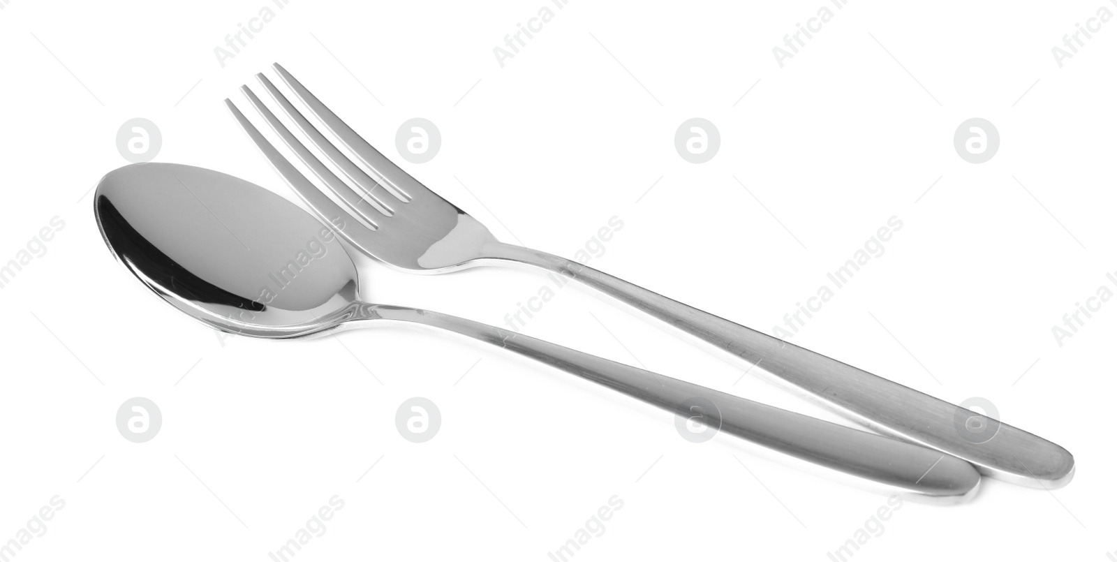 Photo of Shiny fork and spoon on white background