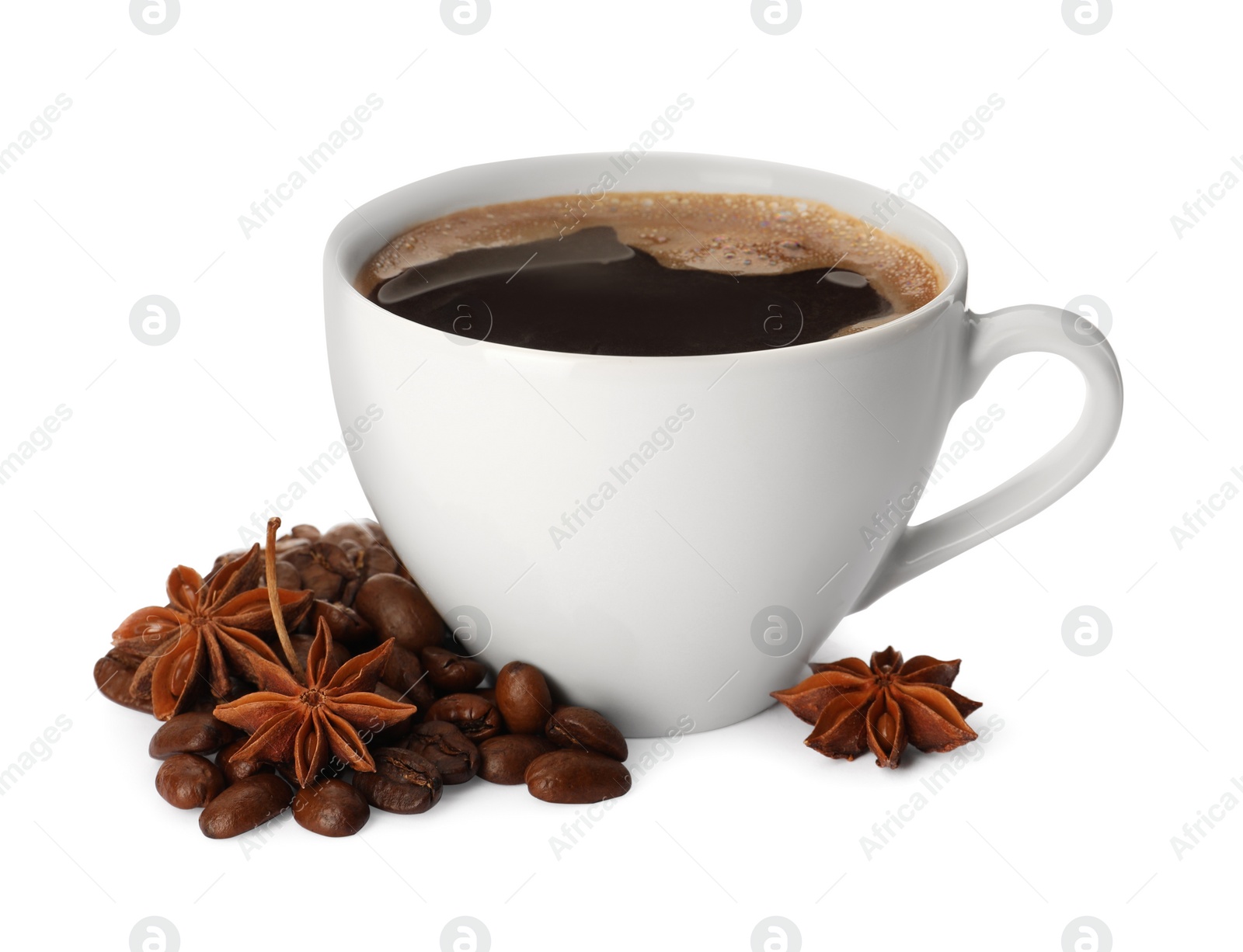 Photo of Cup of aromatic coffee with anise stars and beans on white background