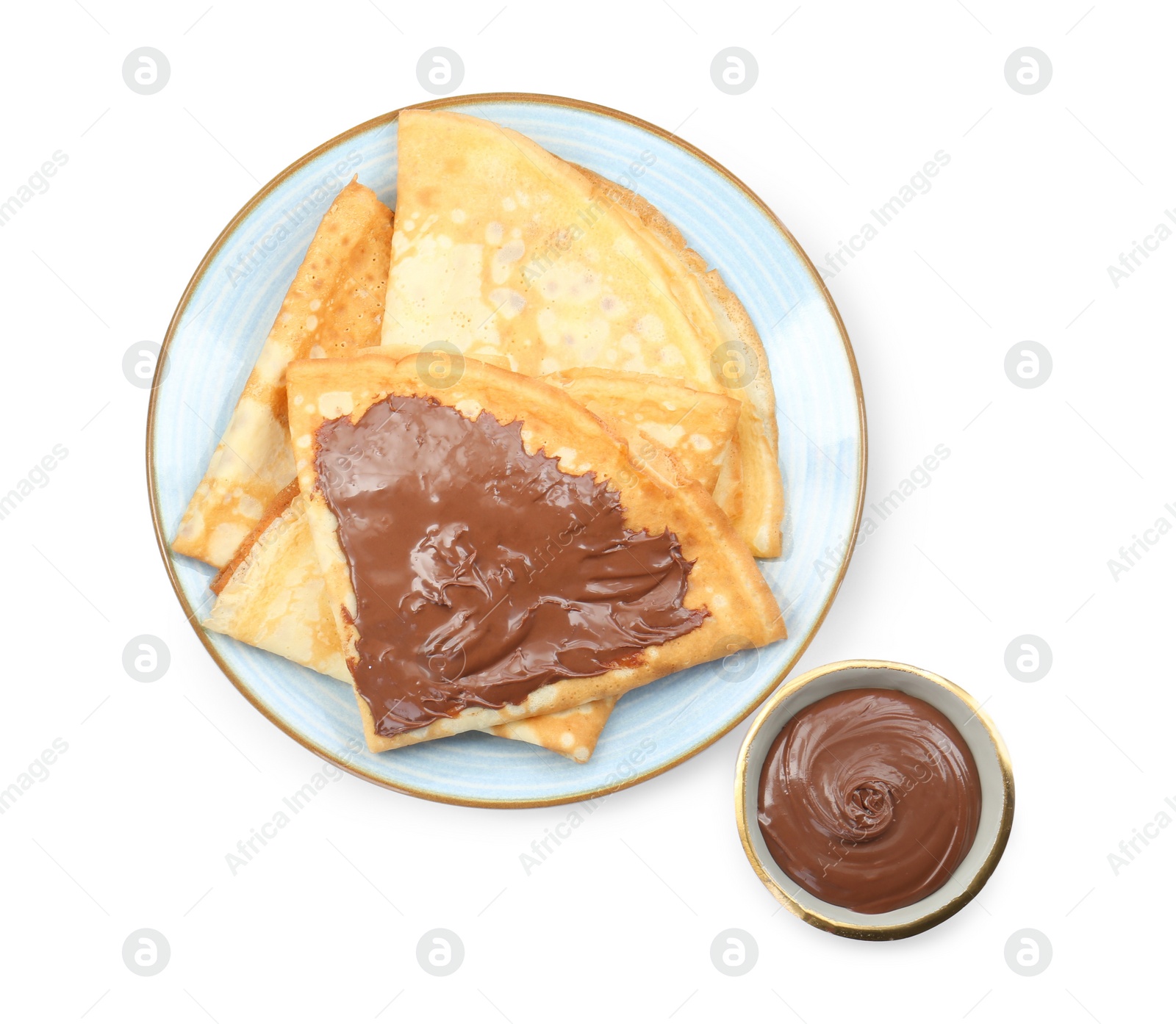 Photo of Tasty crepes with chocolate paste isolated on white, top view