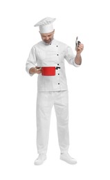 Photo of Chef in uniform with cooking pot on white background