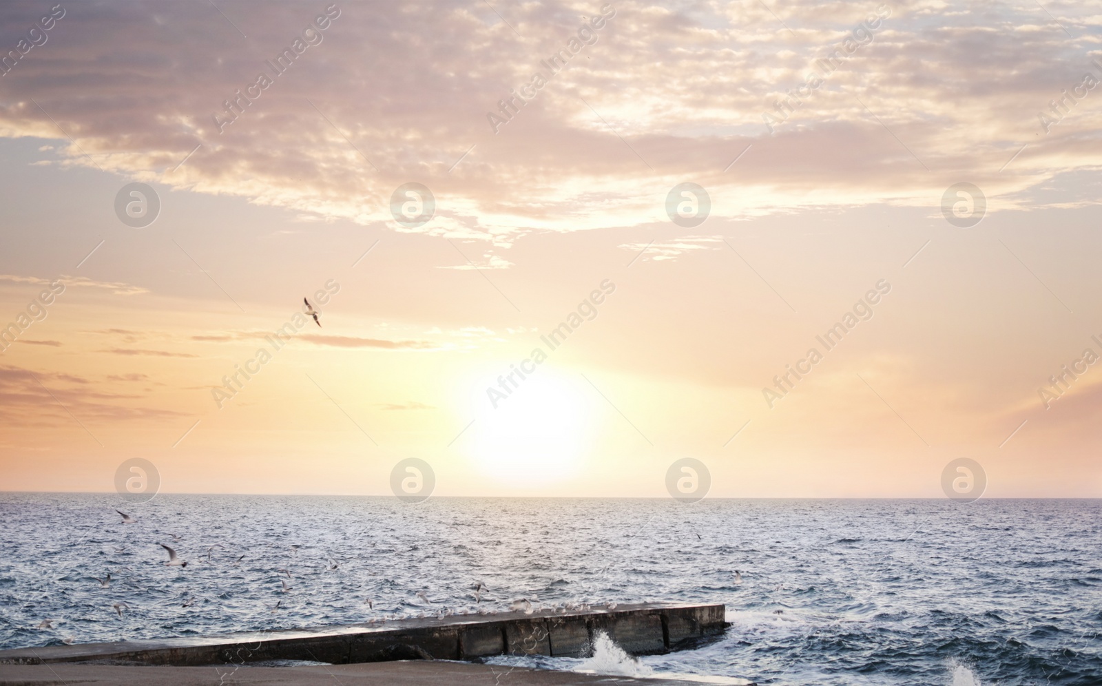 Photo of Beautiful view of pier and sea at sunset