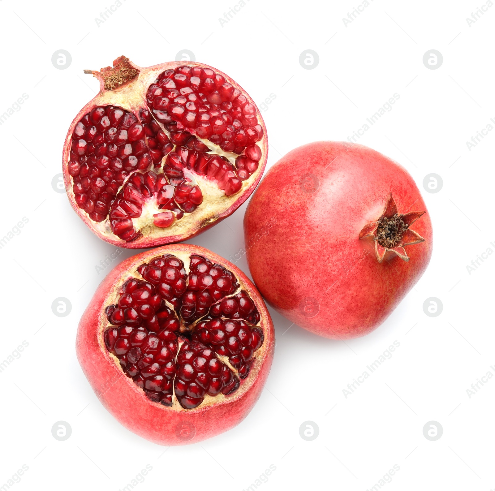 Photo of Whole and pieces of fresh pomegranates isolated on white, top view