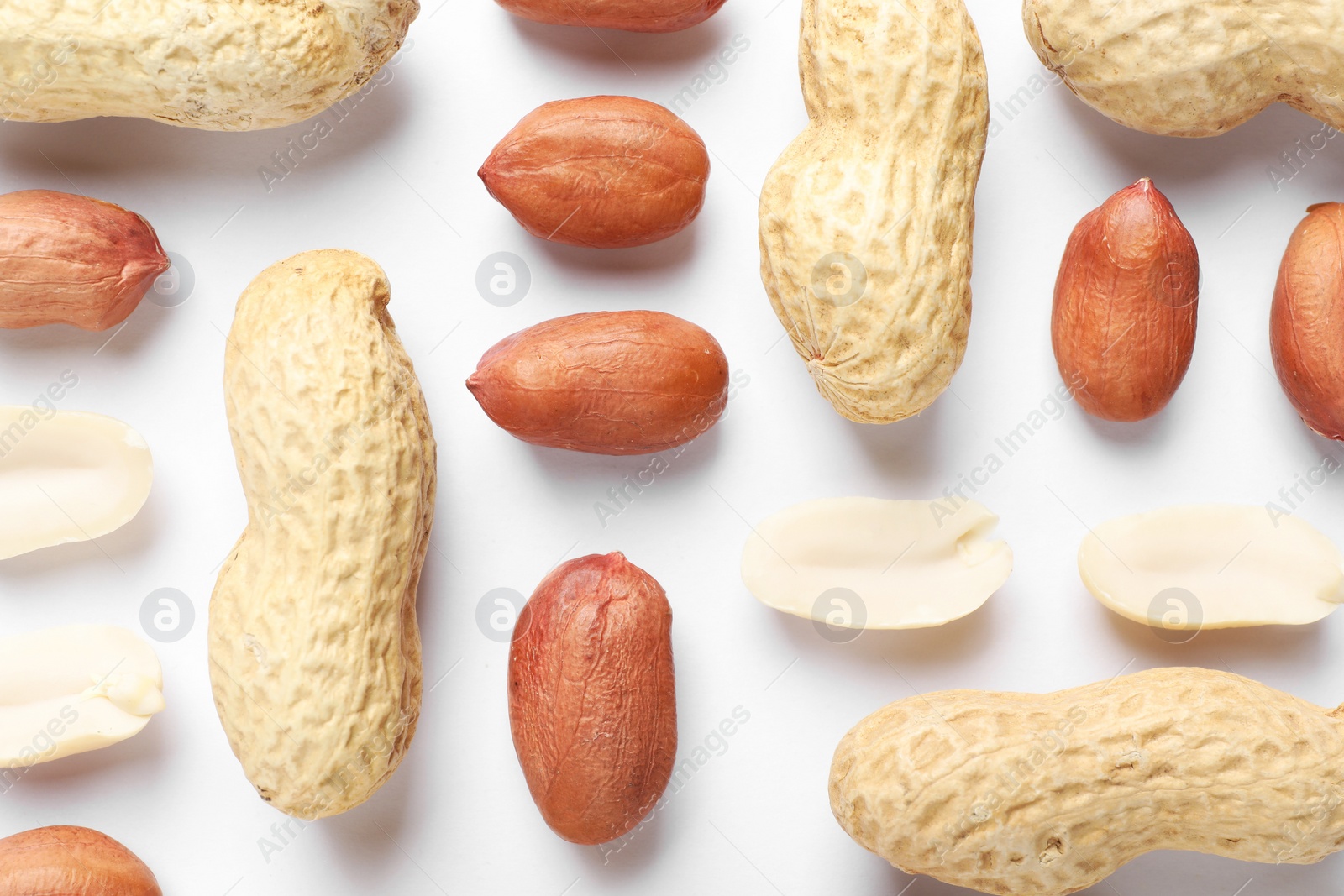 Photo of Fresh peanuts on white background, flat lay