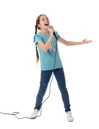 Photo of Cute girl singing in microphone on white background