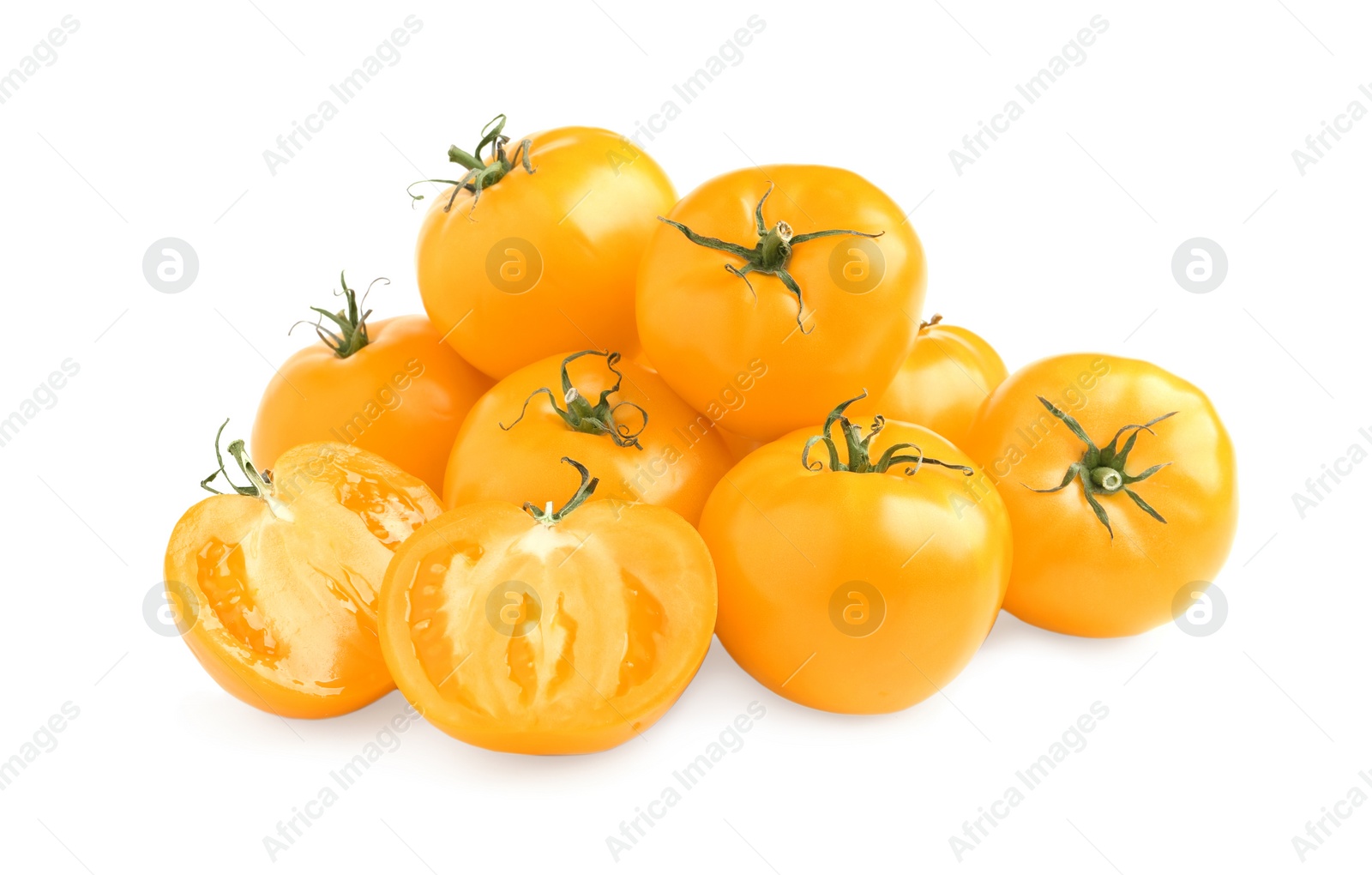 Photo of Cut and whole yellow tomatoes on white background