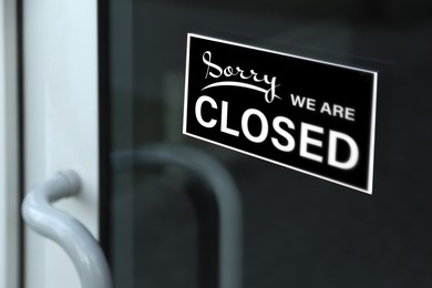 Sorry we are closed sign on glass door