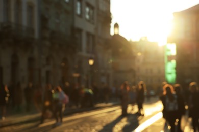 Blurred view of people walking on city street