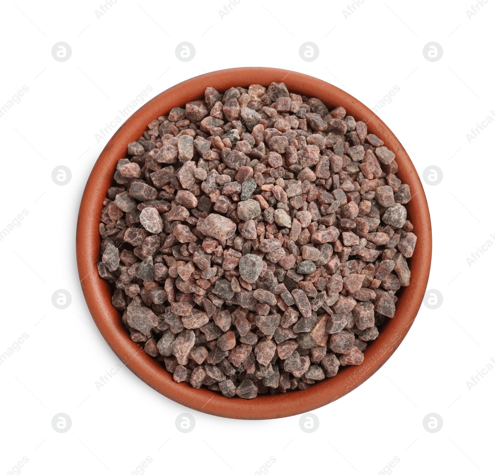 Photo of Indian black salt in bowl isolated on white, top view