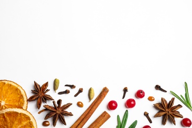 Photo of Different mulled wine ingredients on white background, flat lay. Space for text