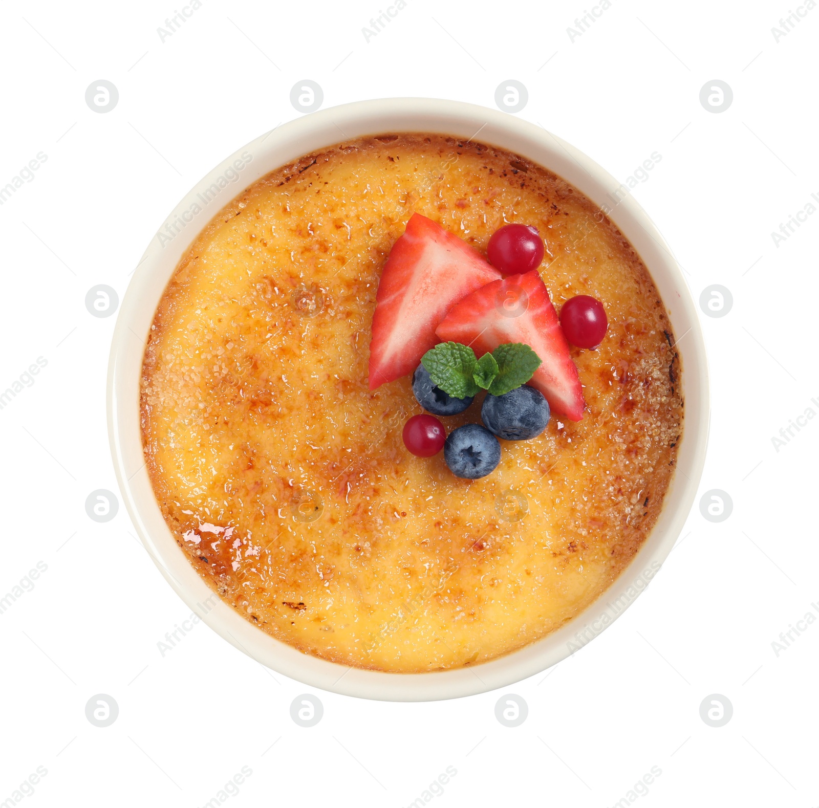 Photo of Delicious creme brulee with fresh berries isolated on white, top view