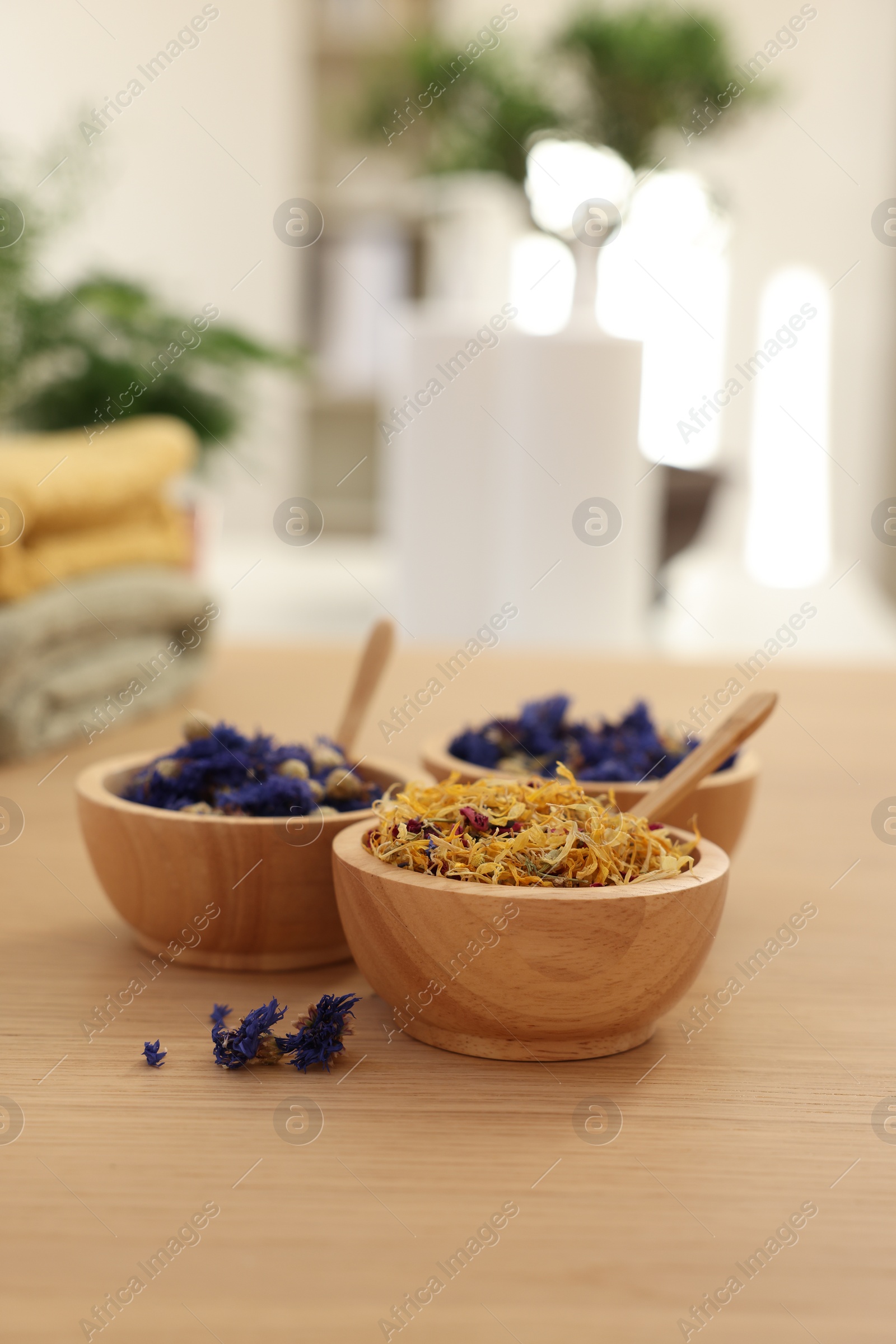 Photo of Dry flowers on wooden table indoors, space for text. Spa time