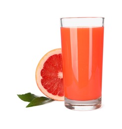 Photo of Tasty grapefruit juice in glass, leaves and half of fresh fruit isolated on white