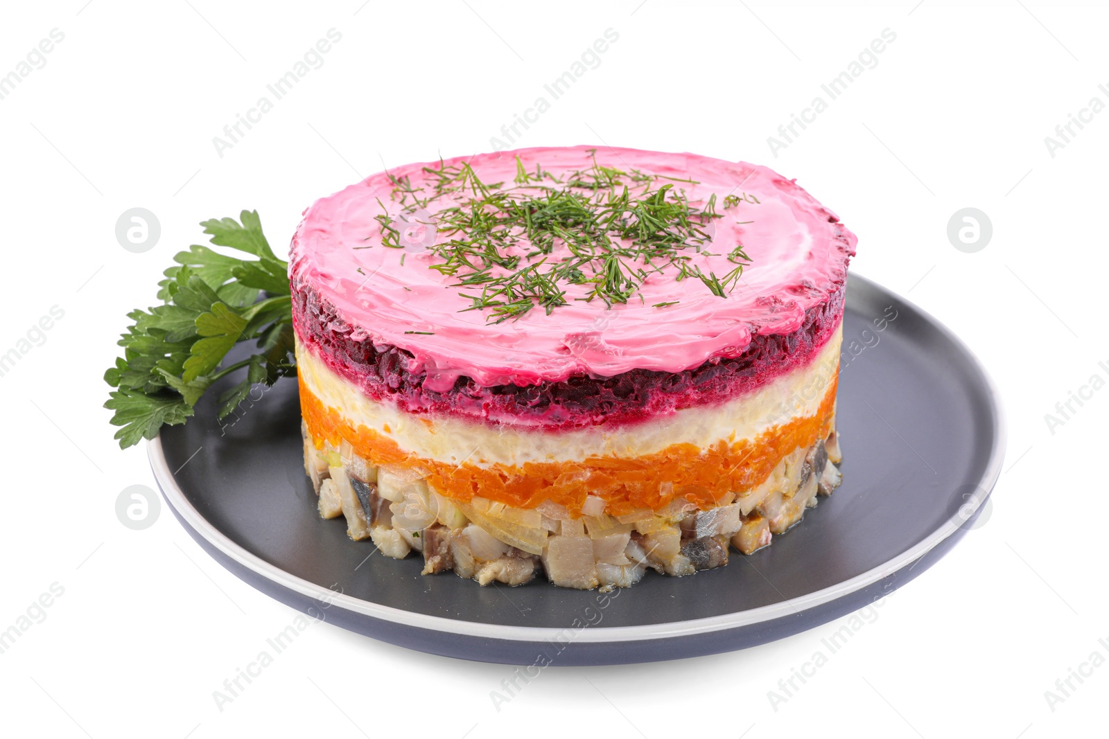 Photo of Herring under fur coat salad isolated on white. Traditional Russian dish