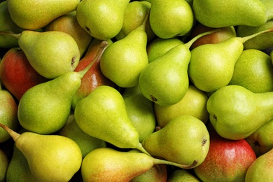 Photo of Fresh ripe pears as background, top view