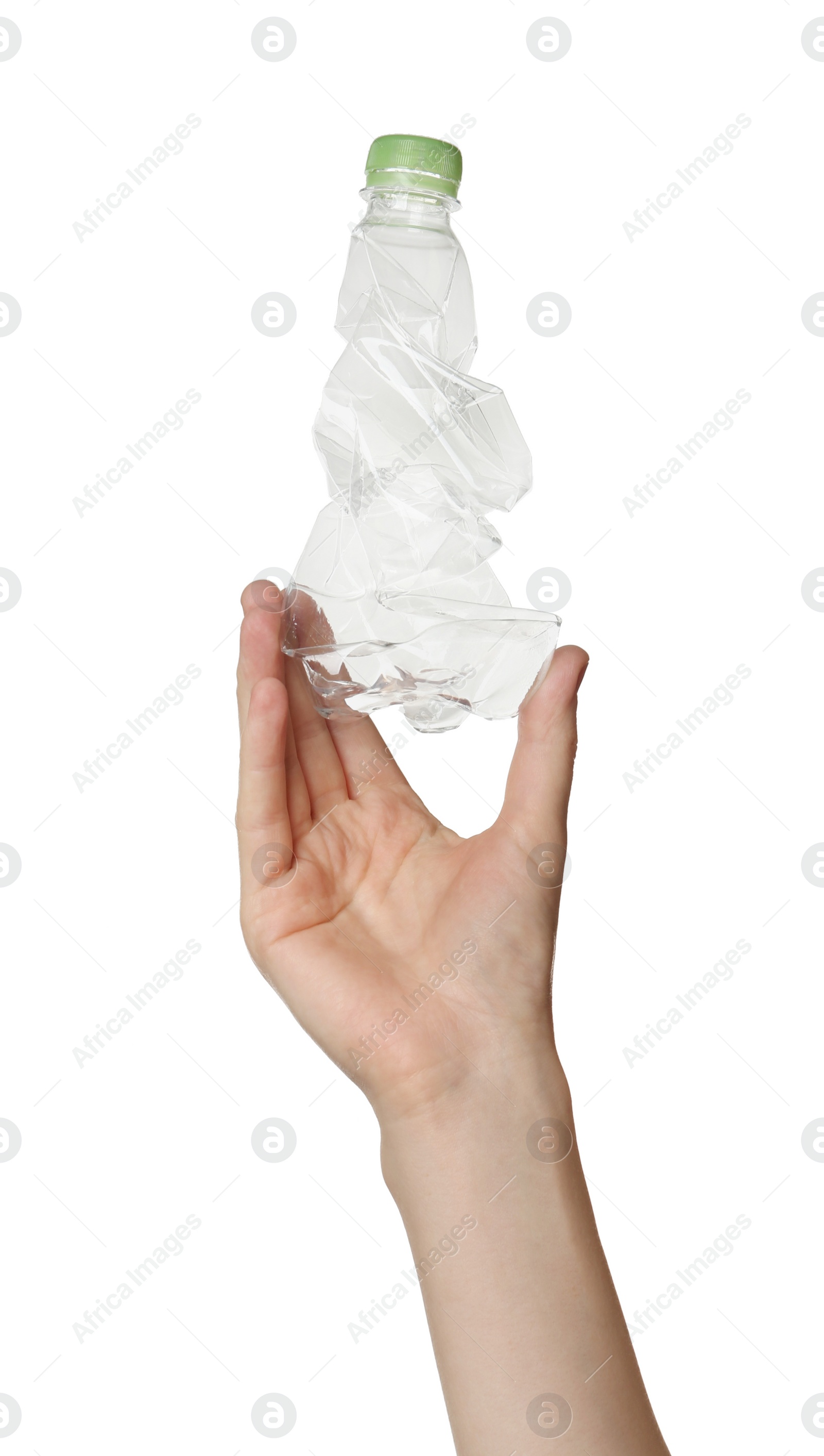 Photo of Woman holding crumpled plastic bottle on white background, closeup