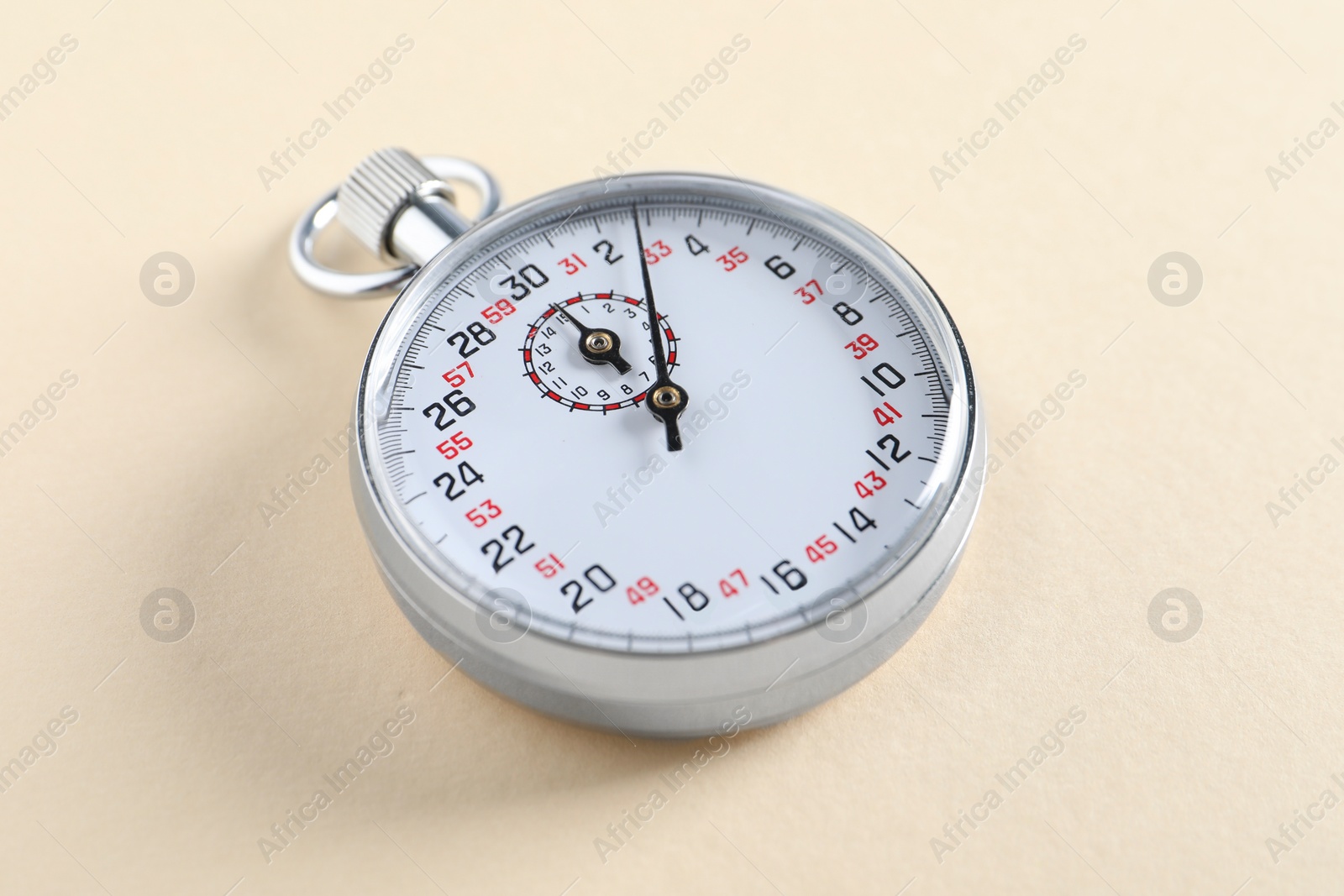 Photo of Vintage timer on beige background. Measuring tool