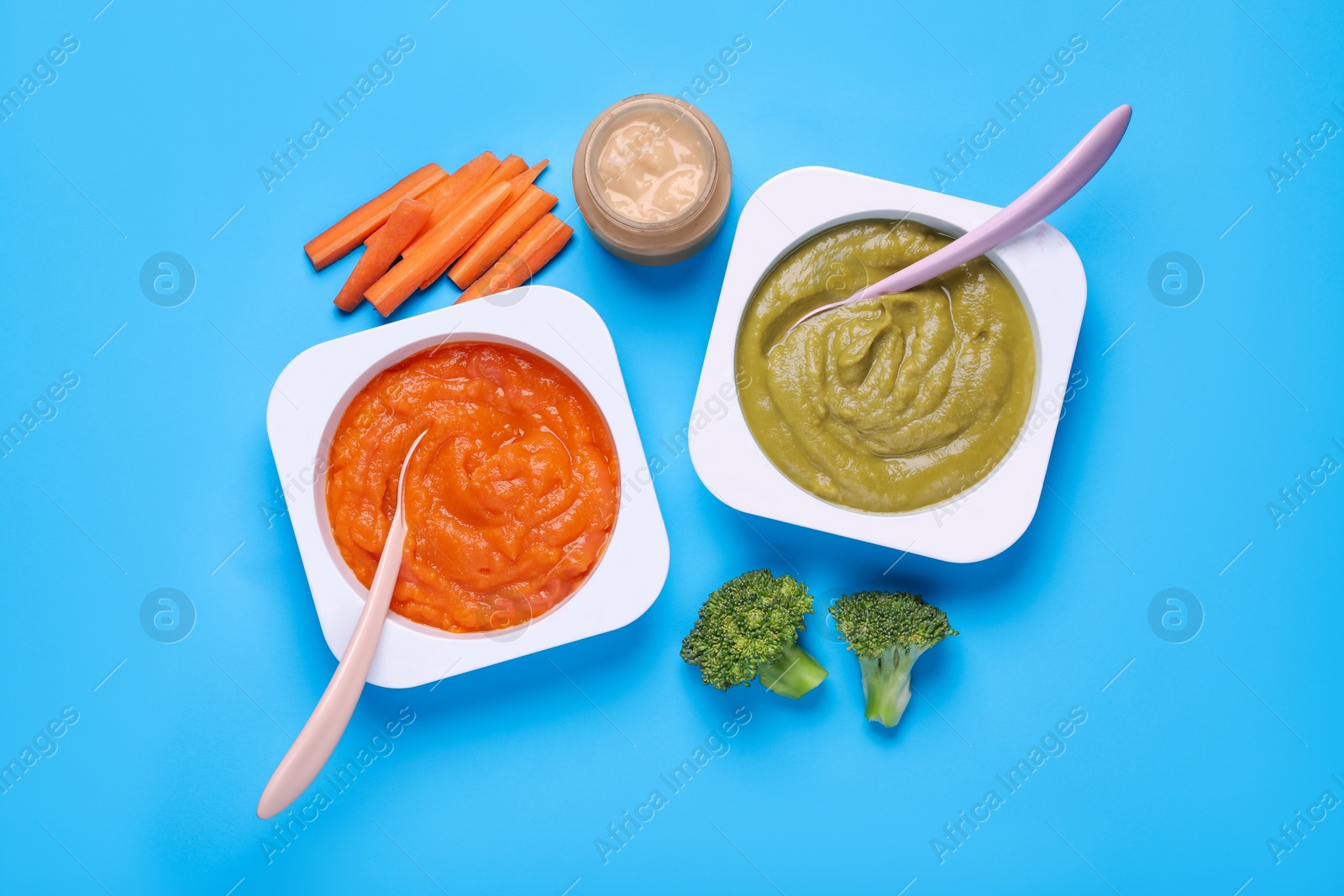 Photo of Healthy baby food and vegetables on light blue background, flat lay