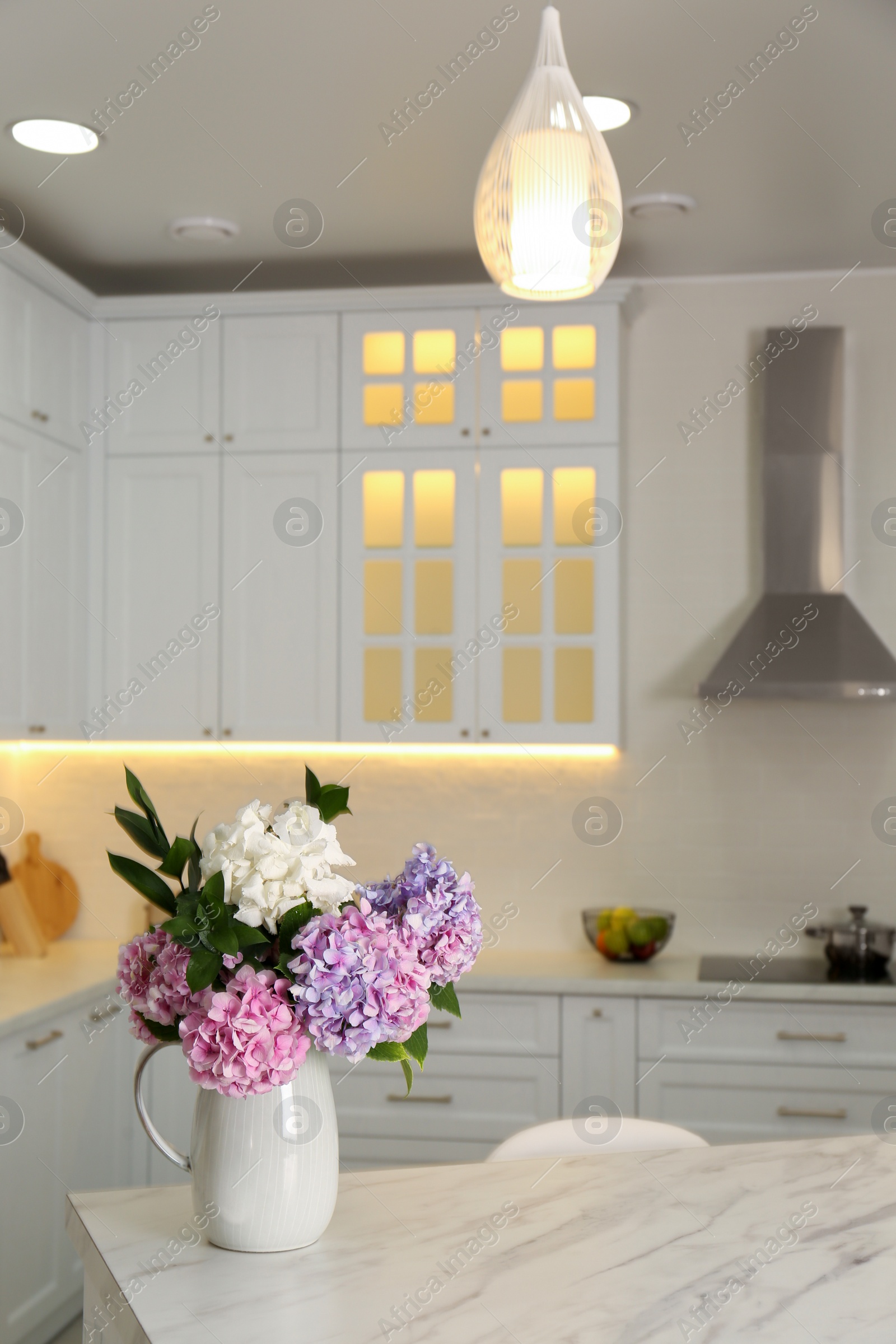 Photo of Bouquet with beautiful hydrangea flowers on white marble table. Space for text