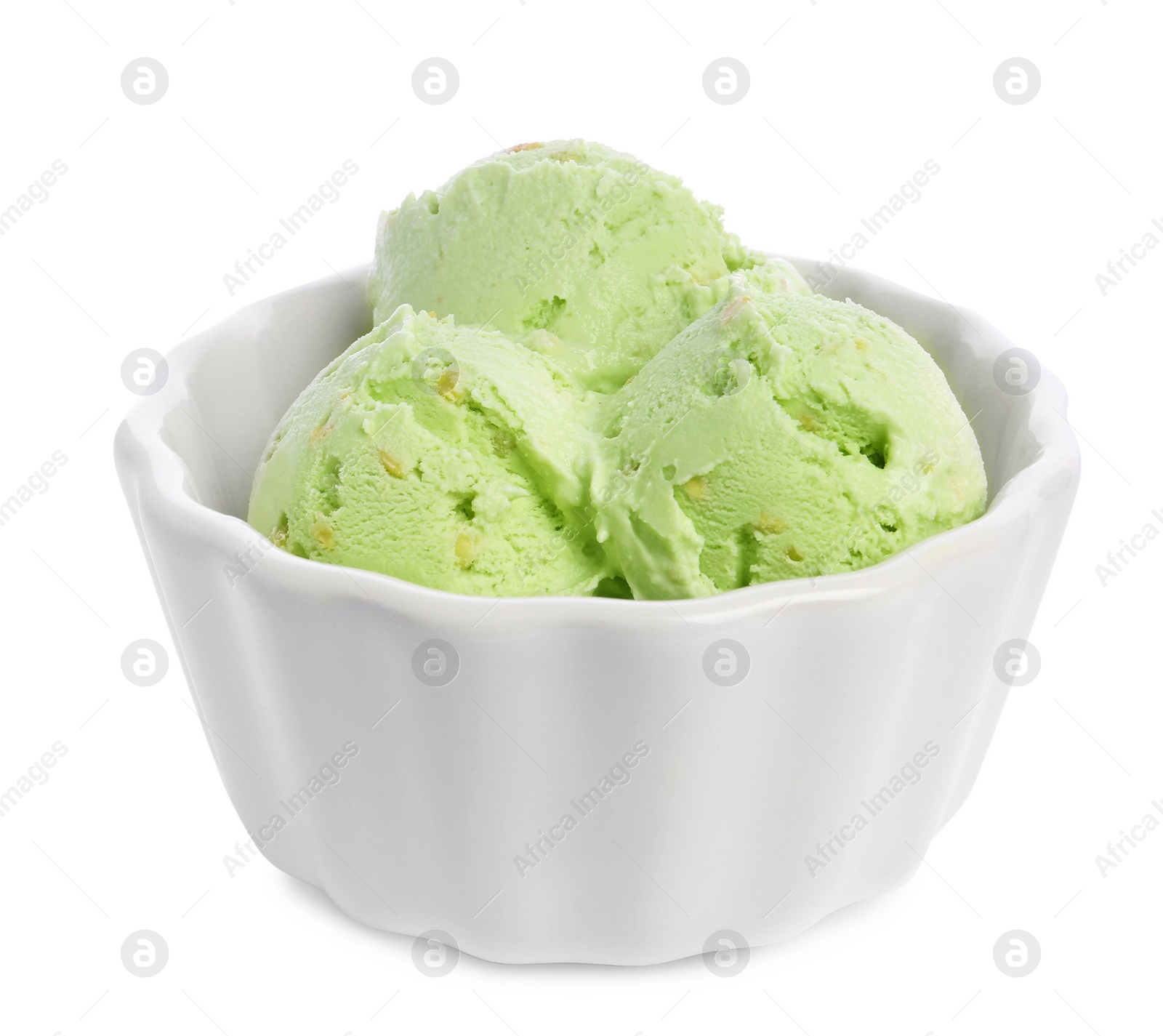 Photo of Bowl of sweet pistachio ice cream on white background