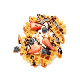 Photo of Delicious waffles with berries and whipped cream on white background