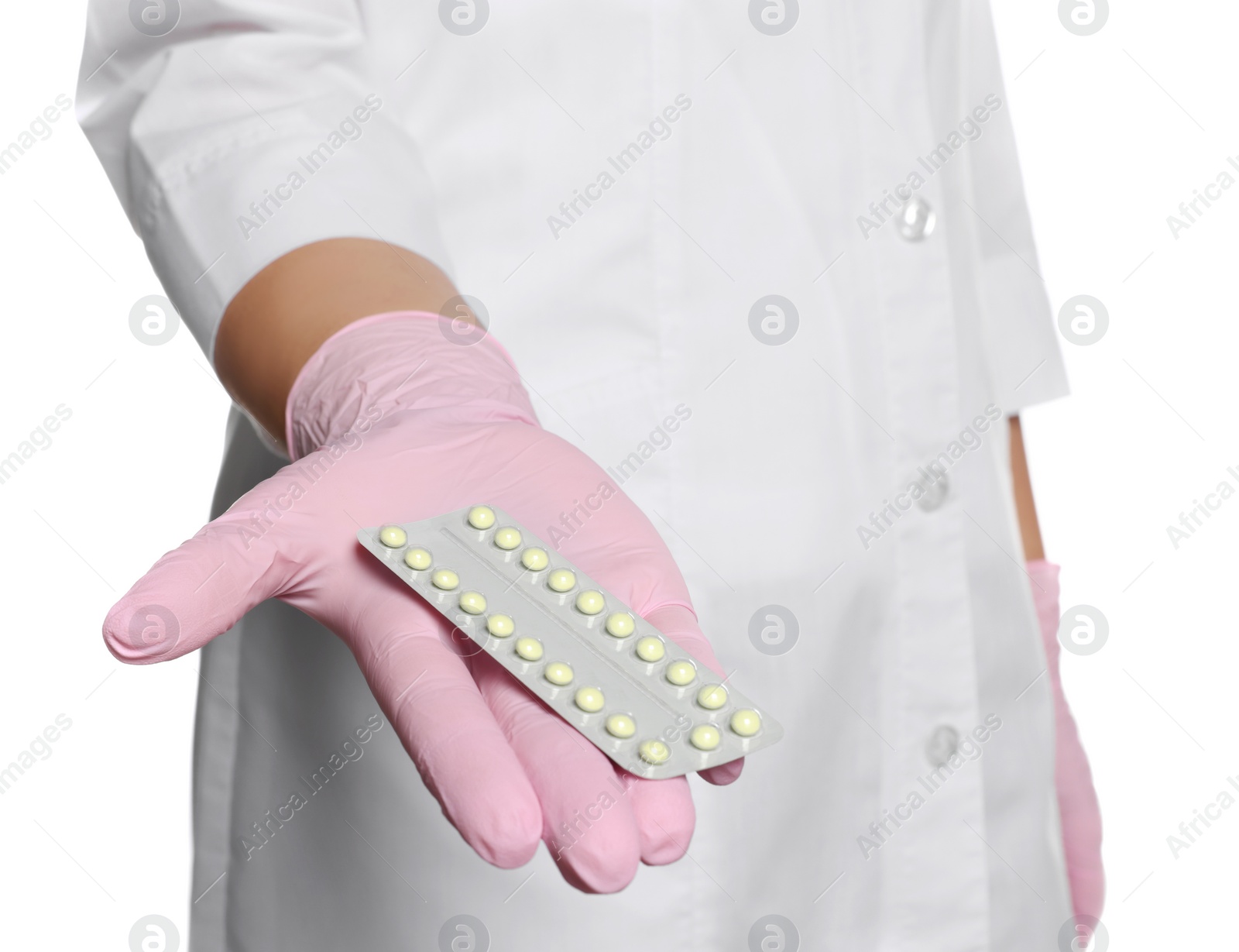 Photo of Doctor holding blister of oral contraception pills on white background, closeup