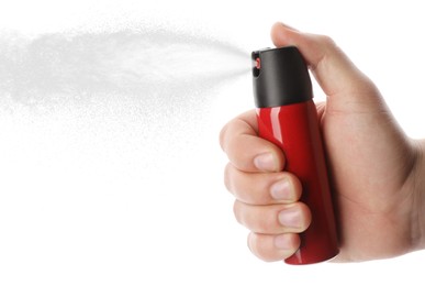 Man using pepper spray on white background, closeup