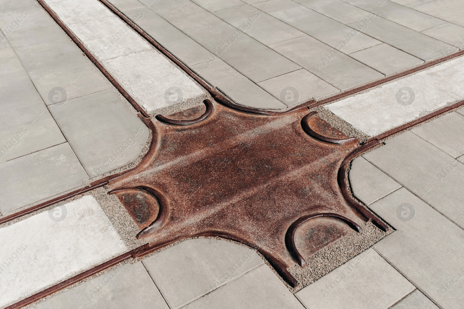 Photo of Street tiles with metal ground surface indicators, closeup