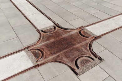 Photo of Street tiles with metal ground surface indicators, closeup