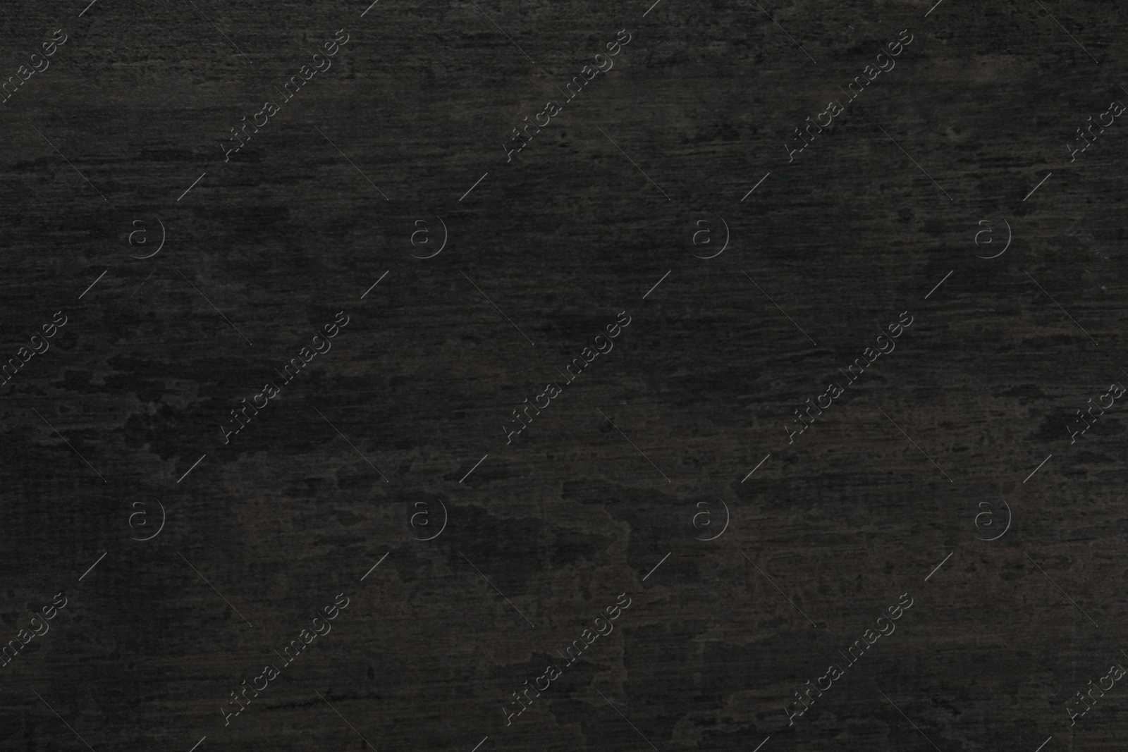 Photo of Texture of black stone surface as background, closeup