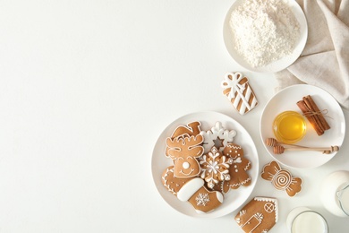 Flat lay composition with delicious homemade Christmas cookies on white table. Space for text