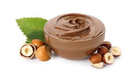 Photo of Glass bowl with tasty chocolate hazelnut spread and nuts on white background
