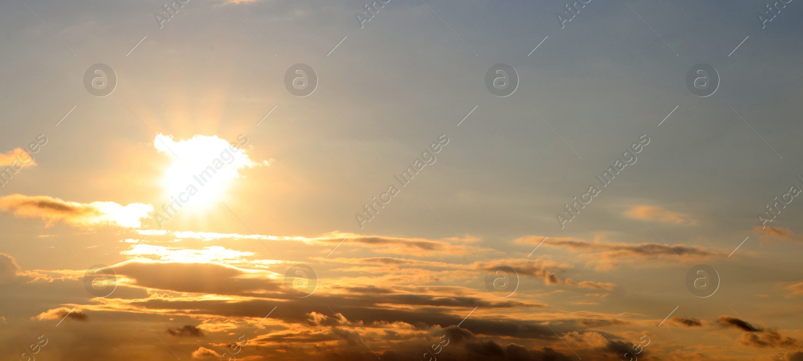 Image of Beautiful cloudy sky at sunset, banner design