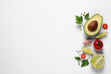 Fresh guacamole ingredients on white background, flat lay. Space for text