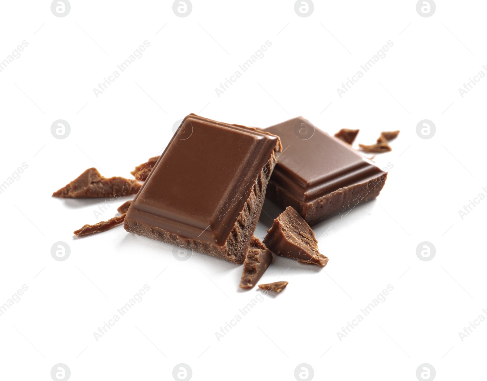 Photo of Pieces of tasty milk chocolate on white background