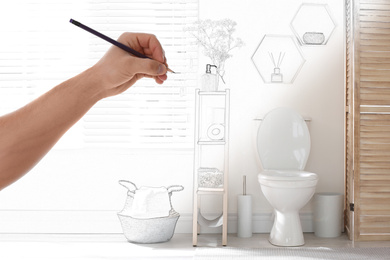 Image of Man drawing bathroom interior design. Combination of photo and sketch