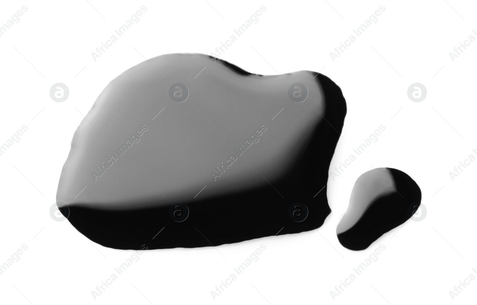 Photo of Blobs of black oil isolated on white, top view