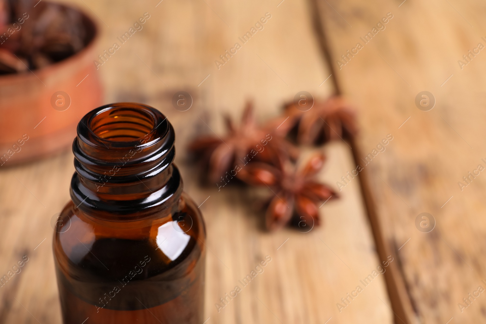 Photo of Bottle of anise essential oil, closeup. Space for text