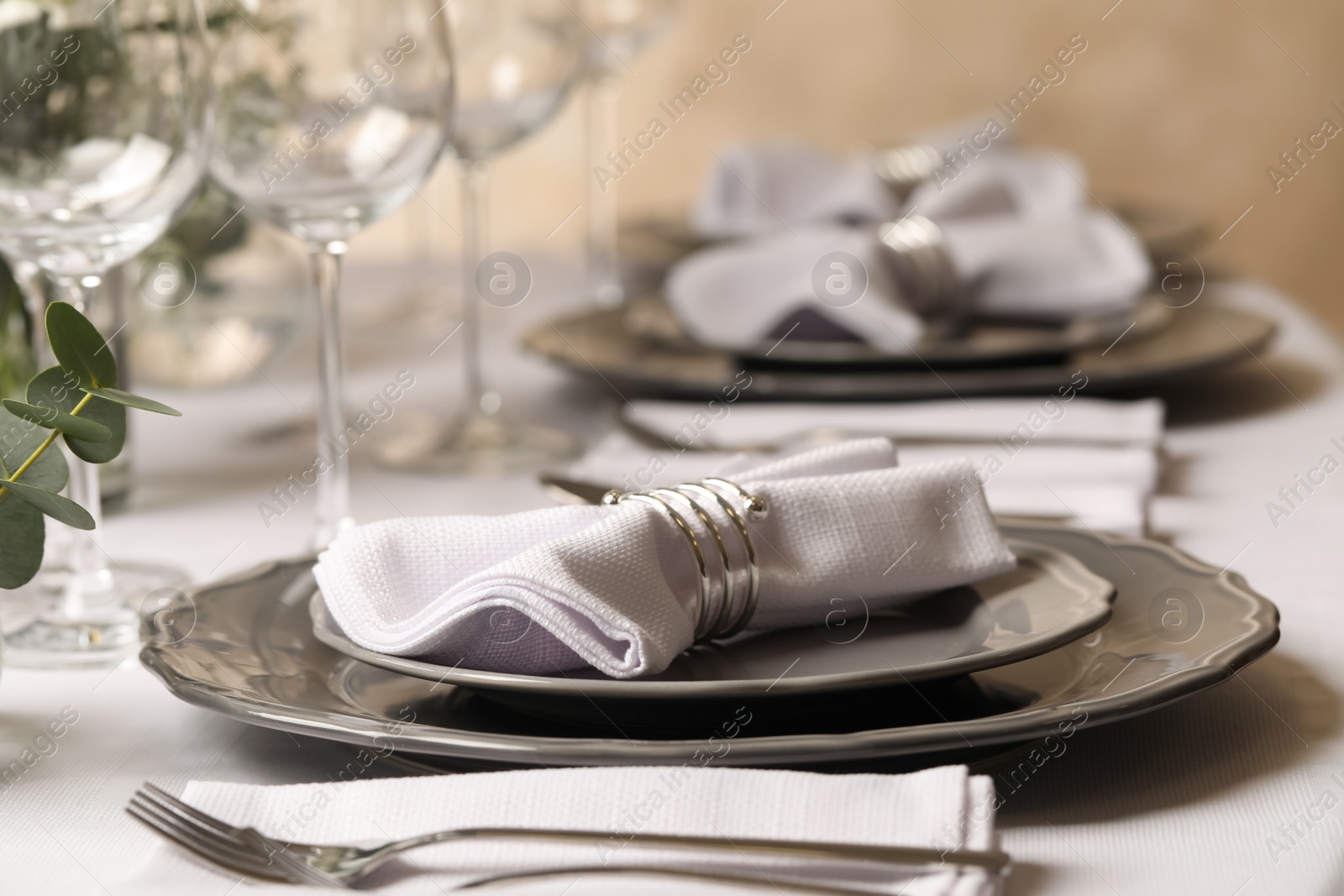 Photo of Stylish elegant table setting for festive dinner in restaurant