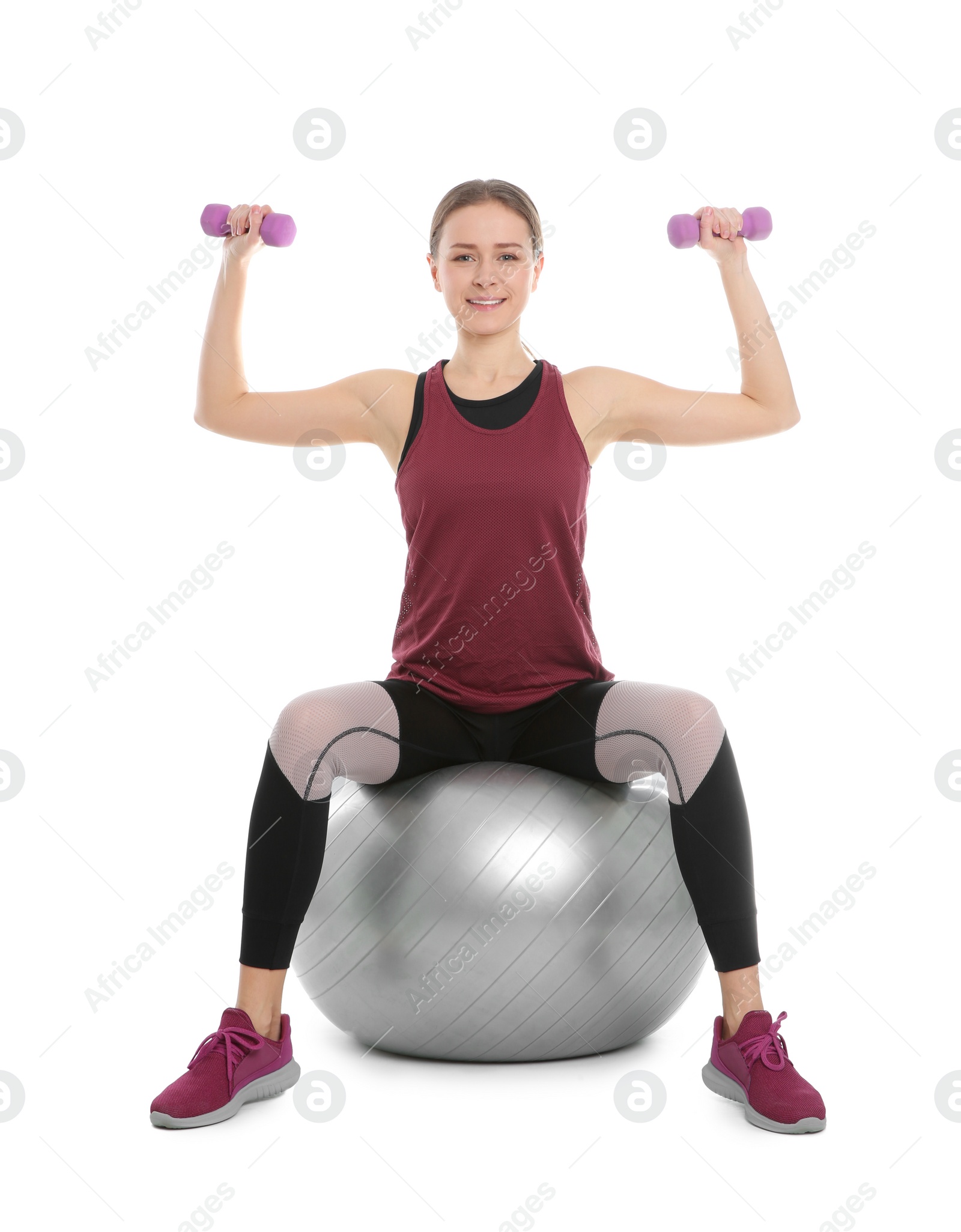 Photo of Young woman doing sports exercises isolated on white. Home fitness