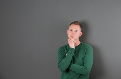 Photo of Portrait of handsome man on color background