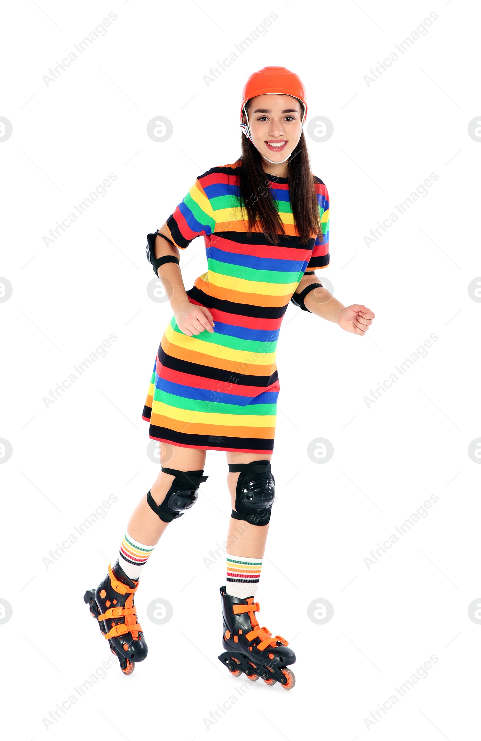 Photo of Young woman in bright dress with inline roller skates on white background