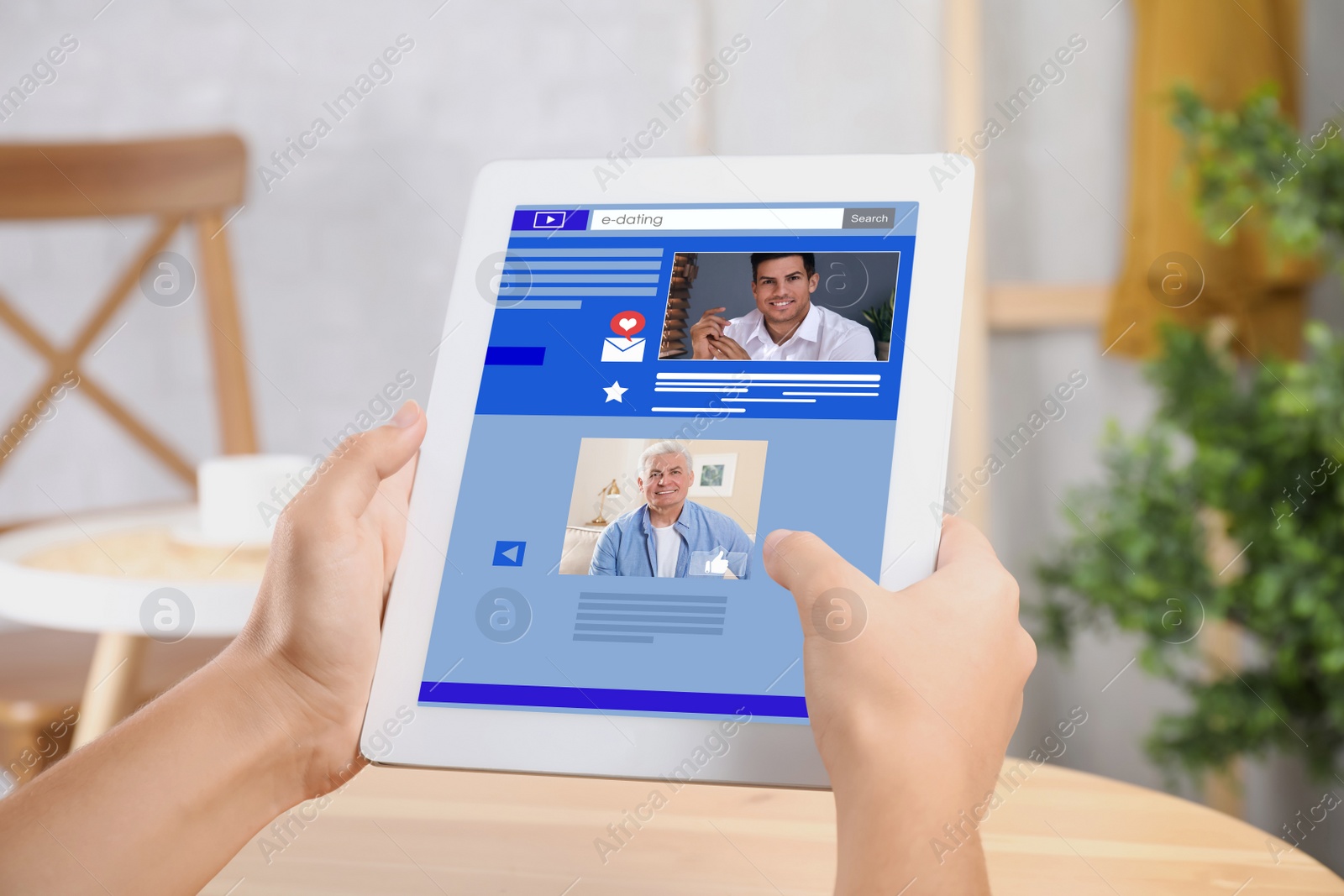 Image of Young woman visiting online dating site via tablet indoors, closeup