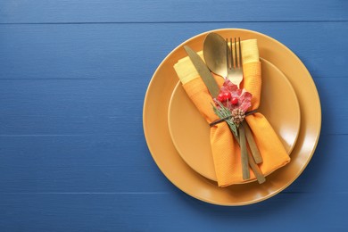 Photo of Thanksgiving day. Beautiful table setting and autumn decoration, top view. Space for text