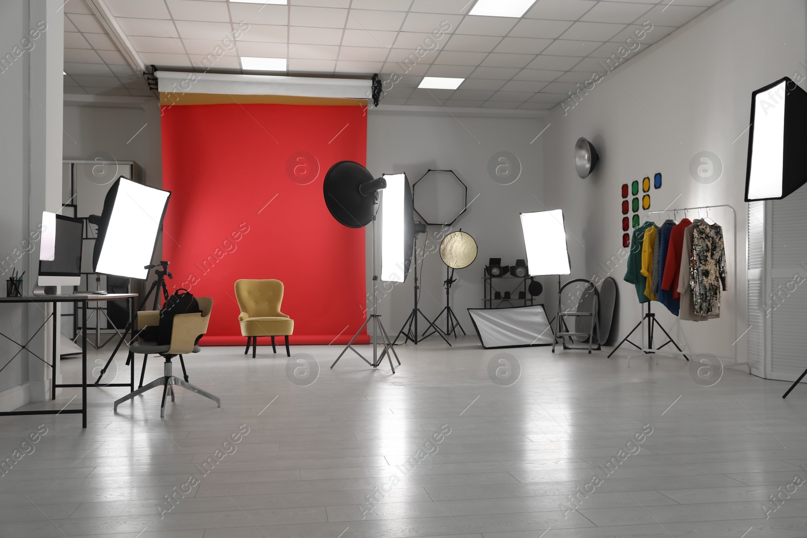 Photo of Interior of modern photo studio with professional equipment