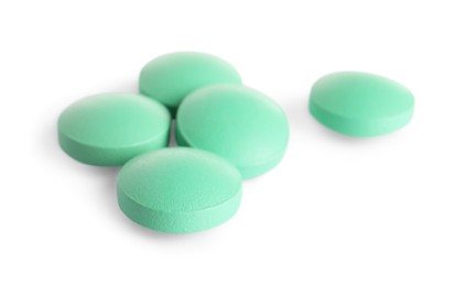 Photo of Many light green pills isolated on white