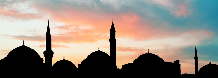 Silhouette of mosque during sunset, banner design. Muslim culture 