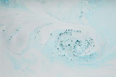 Photo of Foam after dissolving bath bomb in water, closeup