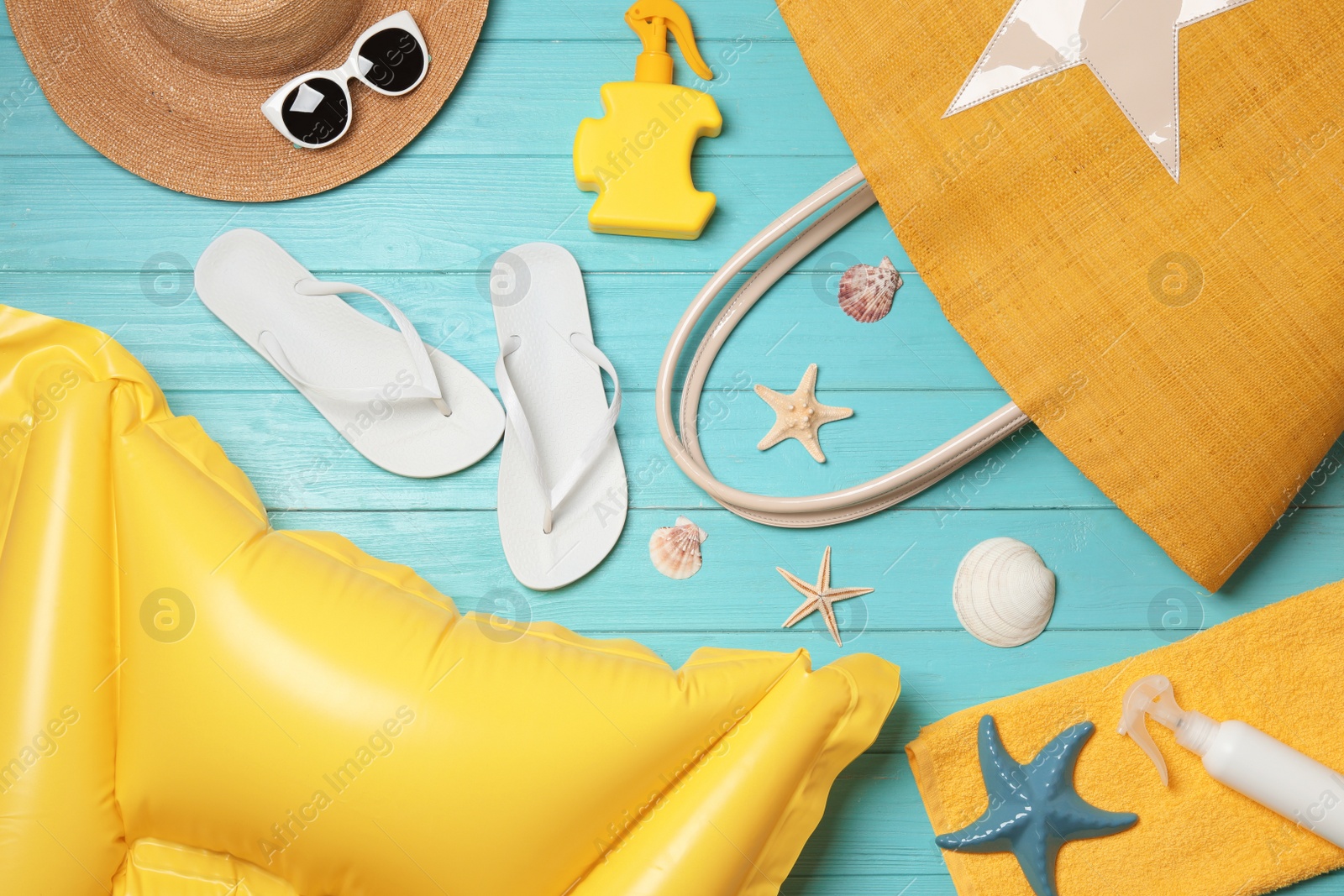 Photo of Flat lay composition with beach accessories on wooden background