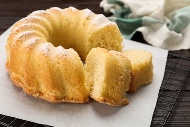 Delicious freshly baked sponge cake on table, closeup