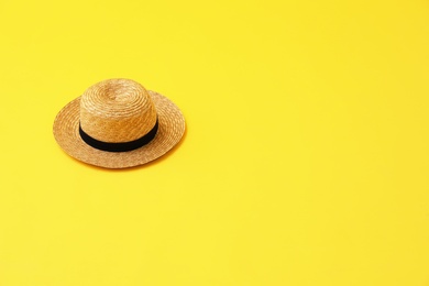 Photo of Stylish hat on yellow background, space for text. Summer beach accessories